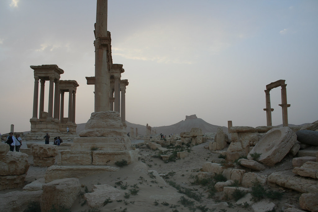 Palmyra - sunset over tetrapylon with olive mill