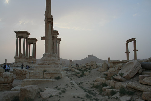 Palmyra - sunset over tetrapylon with olive mill